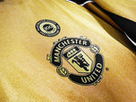 MANCHESTER UNITED 01/02 CENTENARIO (REVERSIBLE)